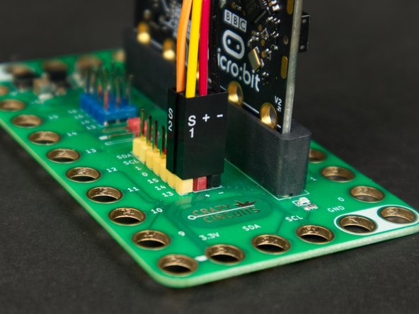 When using the Crazy Circuits Ribbon Cable with the Bit Board you'll notice the wire color match the pin headers on the board.