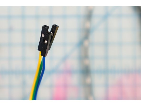 Solder three hookup wires to the +5V, DI, and GND pads on the LED strip.