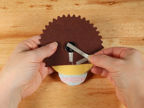 Add Maker Tape to connect the top (Positive) side of the battery to the Positive LED leg path.