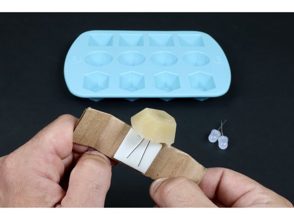 Allow the glue to cool and harden before removing from the mold. If you wish to accelerate this process, simply put the mold tray in the refrigerator.  When you no longer feel any heat conducting through the mold tray from below, remove your uncut gem by pushing up on the underside of the mold.