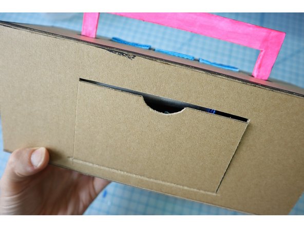 Stuff everything inside the box. If your speakers have a volume adjustment, set it to full volume before closing the door.
