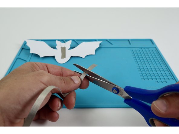 Cut a small length of Maker Tape and create a loop &quot;sticky side out&quot;. 