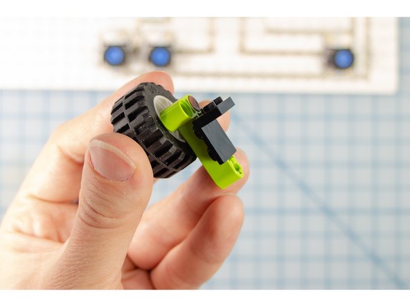 Connect the Technic piece to a LEGO piece that has studs on the side and create a tower under it.