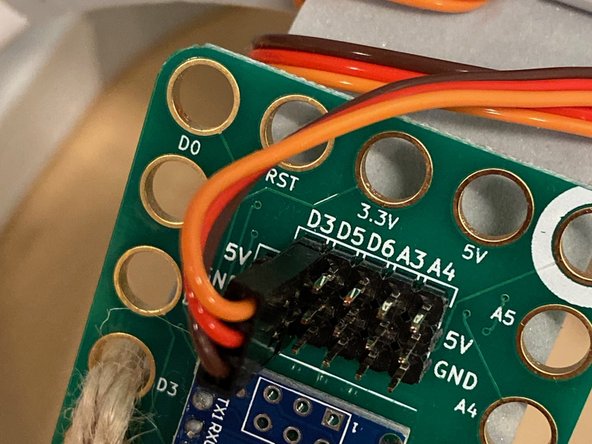 Connect the motor to D3 as shown. You can wind the wire around the structure a few times first so that it takes up the slack.