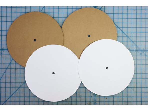 Cut out the circles from white cardstock. If you don't have white cardstock, you could paint the cardboard circles white or reuse the googly eye circles.