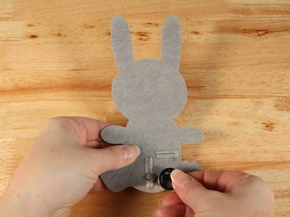 Make sure the Positive side of the Battery is facing upwards, with the Negative side stuck down to the tape.