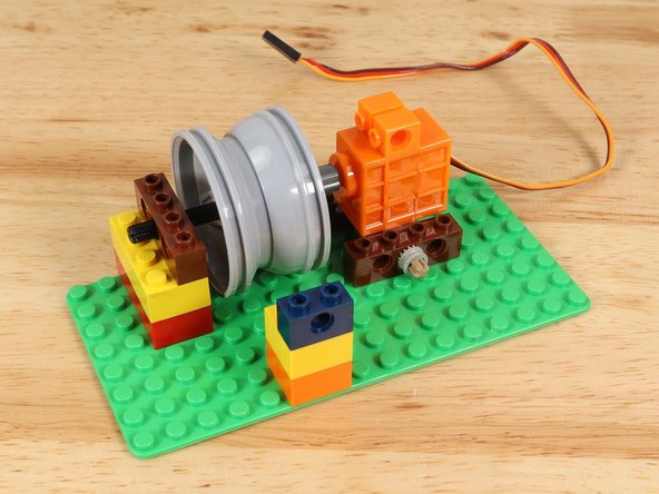 Line it up with the wheel/rim as close as you can, then slide the wheel/rim so it is centered to match the guide hole.