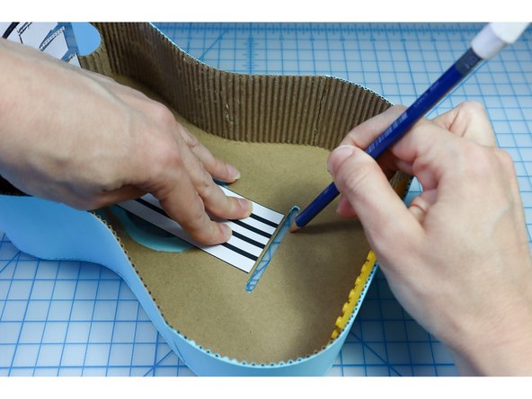 In this guitar build, we'll use maker tape to connect the buttons on the neck of the guitar, and visually they will double as the &quot;strings&quot;.