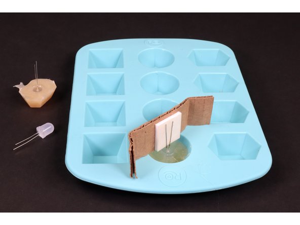 Attach a new LED to the cardboard/tape and make/remove a second jewel using the same process that you did for the first one.