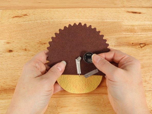 Make sure the Positive side of the Battery is facing upwards, with the Negative side stuck down to the tape.