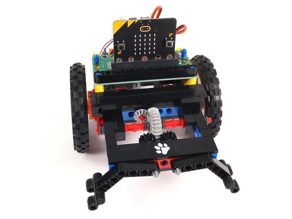 We'll reattach the long black beam onto the blue pins on the front of the Bit Board. This will help hold it securely in place.