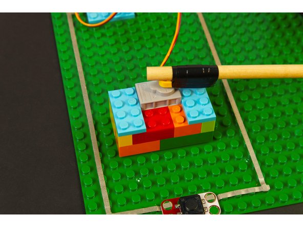 We stuck our servo right down to the baseplate and then added some bricks around it to hold it in place.