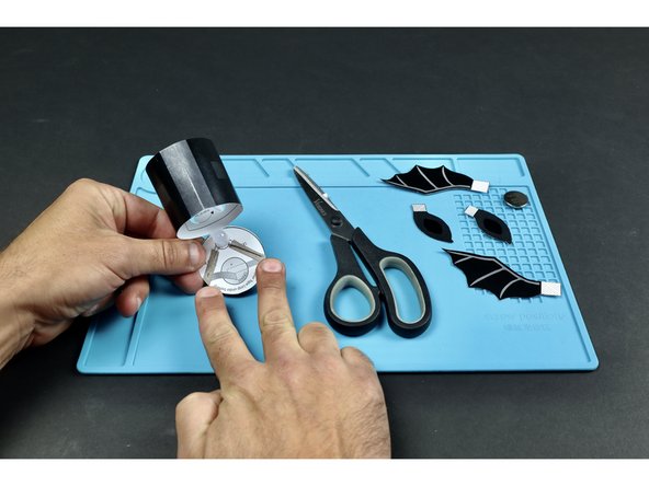 Use the circuit diagram on the back of the project's circular lid to assemble the circuit.