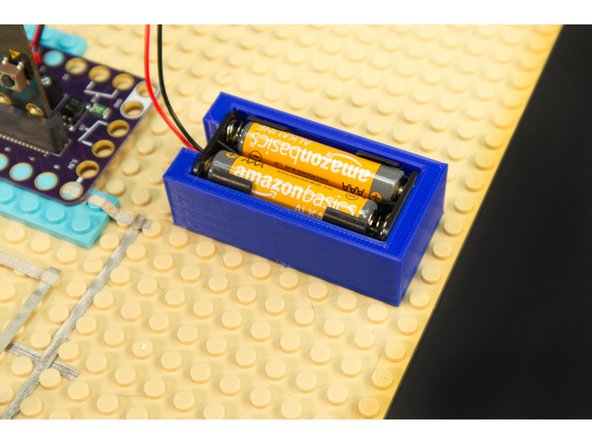If you've got a 3D printer around, you can print our 2AAA Battery Holder.