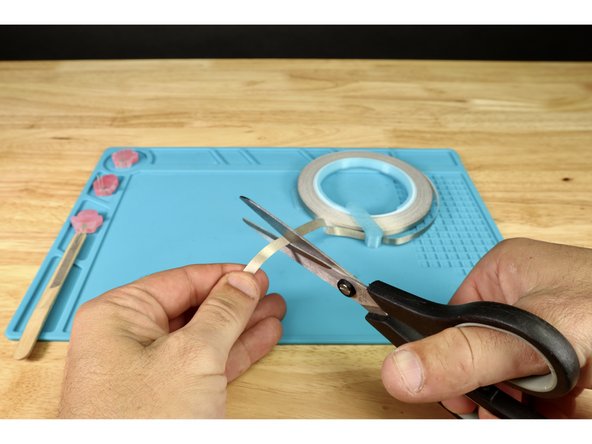 Cut another short piece of Maker Tape as shown  and wrap it from the end of the front path, around to the opposite side of the stick as shown.