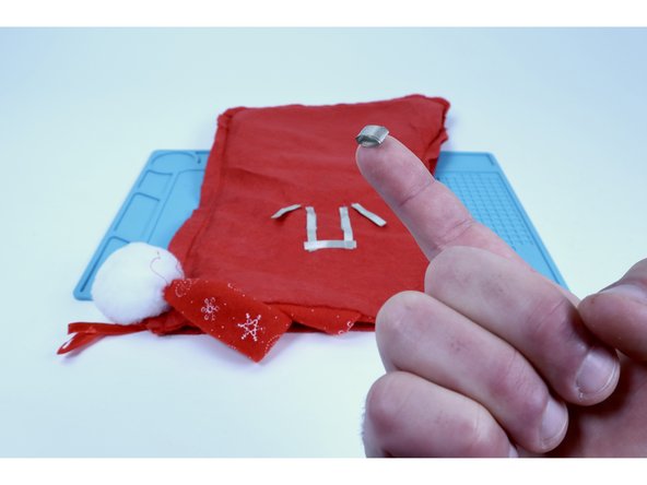 Cut another small piece of Maker Tape and make a tape loop with it.