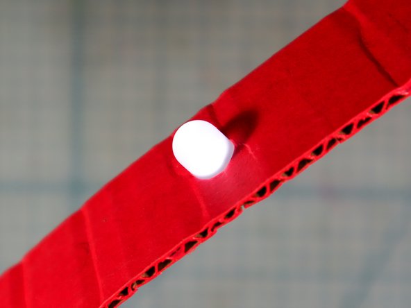 Now, add an extra piece of Maker Tape on top of the LED legs. This should &quot;sandwich&quot; the legs in between two pieces of Maker Tape and the LED should light up!