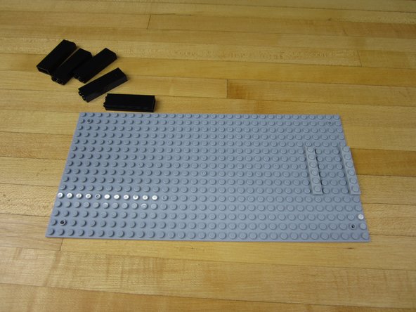 Use a large LEGO plate of some kind as your base. You'll need one with room for the gears on the back.