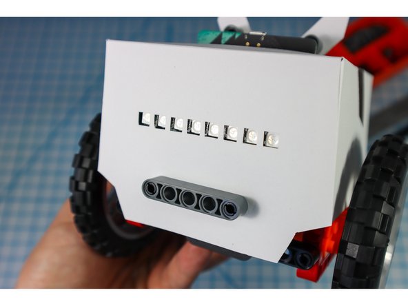 Use a beam to secure the front in place as shown.