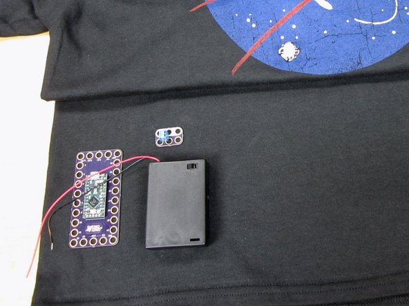 Sew down the Invention Board with regular thread.