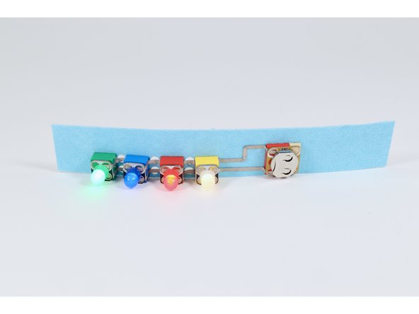 Make a multi-colored 4 LED light up bracelet using a piece of felt along with some LEGO bricks and Crazy Circuit parts.