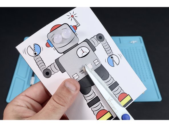 Peel the backing of that excess and cut to reveal the sticky side.