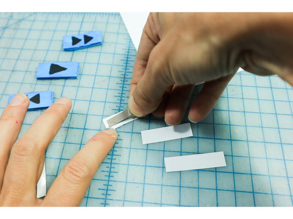 The buttons will close the gap between the two pieces of Maker Tape.