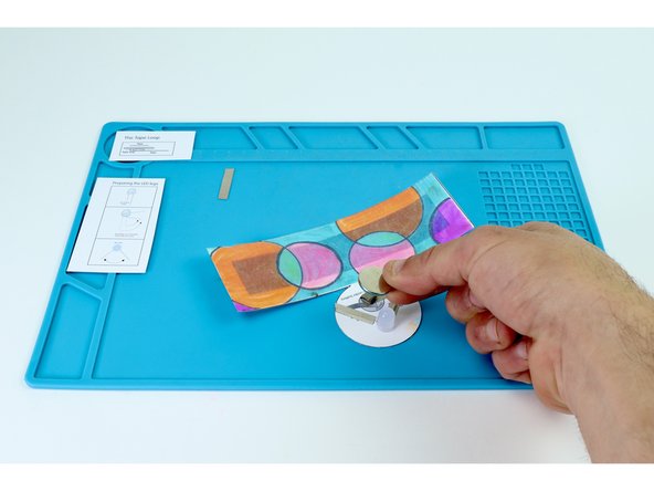 Place your battery positive (+) side UP atop the tape loop.