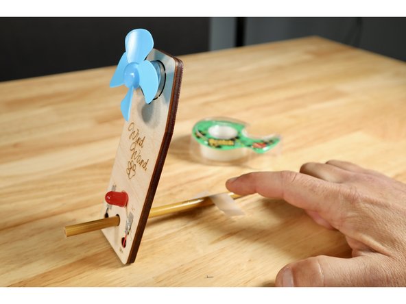 Use this basic testing procedure to gauge and compare the efficiency of the variety of fan styles that can be fashioned with materials in your kit. The blue fan alone will still drive the generator enough to light up your LED but some simple changes can impact output efficiency. Set this test up and try it first with the basic blue fan.