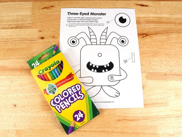Color and cut out the top layer of the monster template, the eye, and the switch.