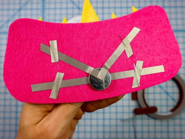 Place a piece of Maker Tape on top of each leg to make a secure connection.