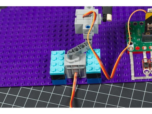 If you're connection is too rigid and you don't calibrate your mallet servo properly it may stress the servo by overworking it. We've also compensated for this with a somewhat &quot;loose&quot; connection point between the two servos.