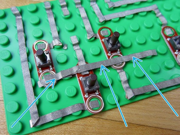 Fold over the edge. Same process that was used for the A &amp; B buttons to bridge.