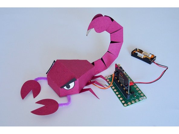 Touch the GND pin on the Bit Board then touch ScorpioBot's stinger!