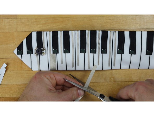 In order to create a larger Touch Point for us to activate we're going to overlap on 1/4th inch Maker Tape at the ends of our 1/8th inch tape lines.