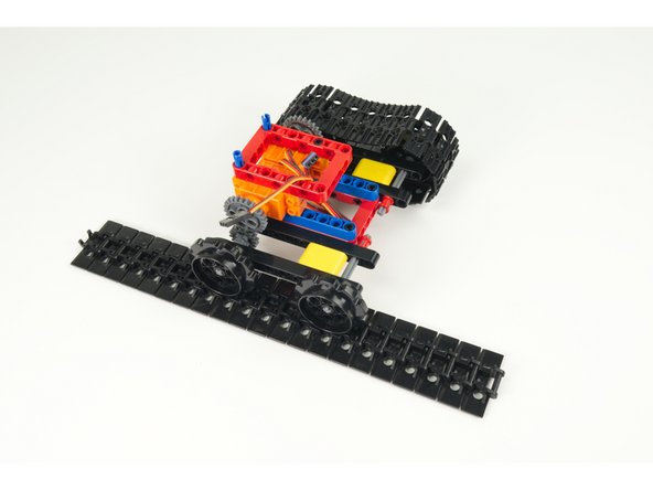 Snap the ends of the tracks together on each side.