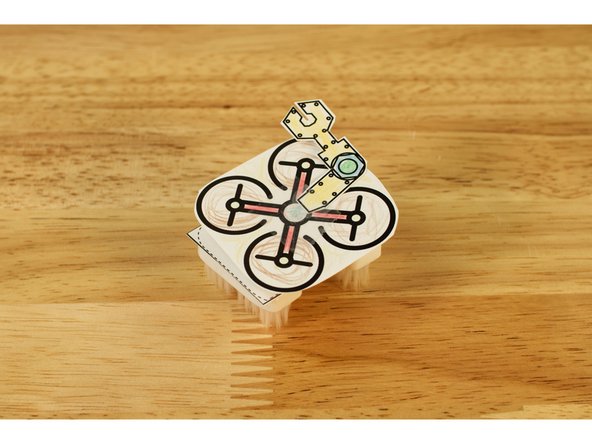 There's also a robot arm on the template that you can add to your drone bot. Just attach to the top with clear tape.