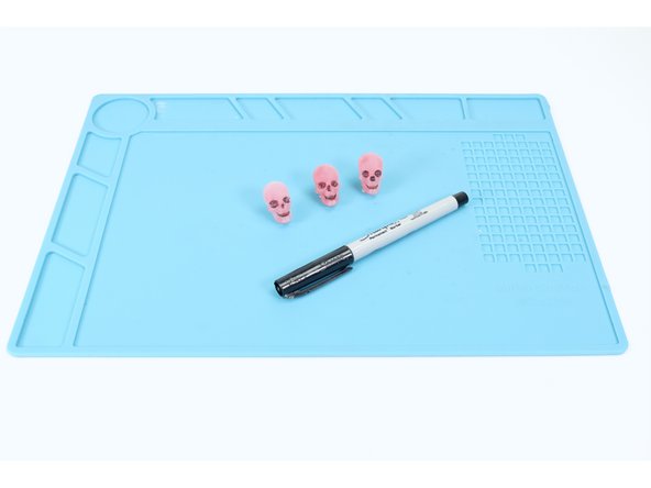 Optional: Use a fine tipped black permanent marker to color in the recessed details!