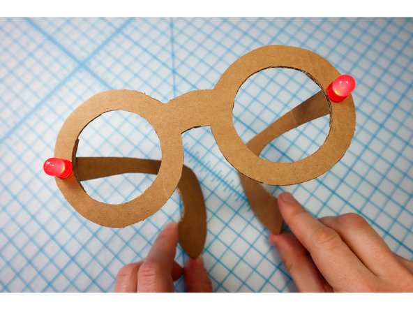 With the circuit connected, it should light up! Check that both LEDs are illuminated, and if not, check the circuit connections on each side.