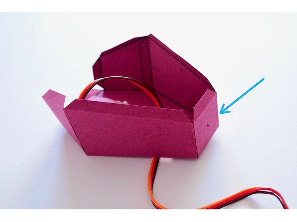 Fold and glue the back tab of the body.