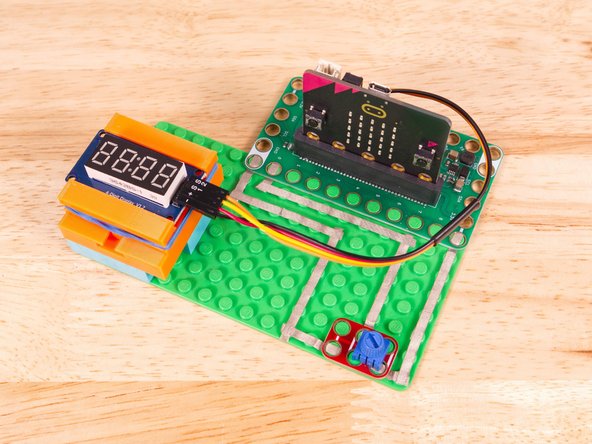 Start by plugging the connector with the three wires in it (Black, Red, Yellow) into the Pin 1 row of the Bit Board. (Make sure the Black wire is in - and the Yellow wire labeled S1 is closest to the number 1 on the Bit Board.) We can then plug the Orange wire labeled S2 into Pin 0 on the Bit Board.