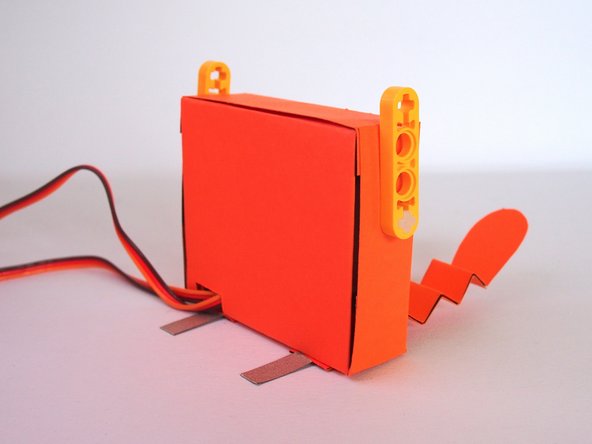 The tabs should stick out the back.