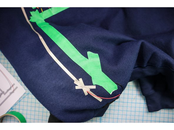 Add masking tape on top of the circuit to prevent a short circuit while you are wearing it.