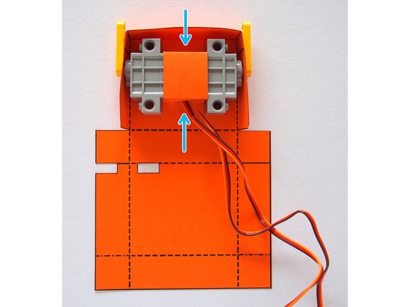 Glue the servo holder so it holds the two servos in position.