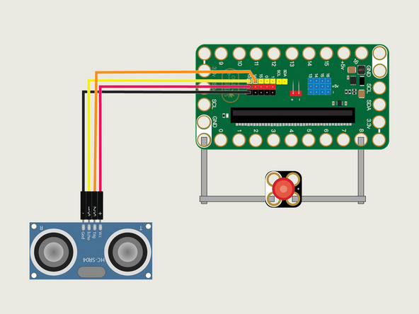 Add the Ultrasonic Distance Sensor by connecting it to the header pins on the back of the Bit Board using a Crazy Circuits Ribbon Cable.