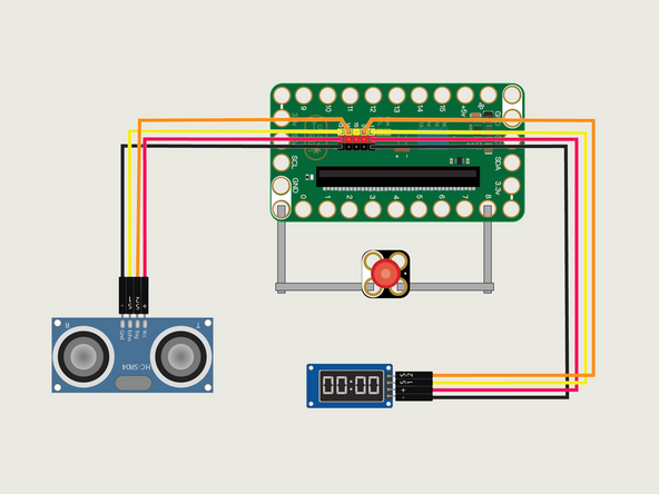 Add the 7 Segment Display by connecting it to the header pins on the back of the Bit Board using a Crazy Circuits Ribbon Cable.