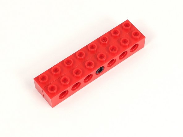 Add a second 1x8 brick with holes to the other side of the black pin.