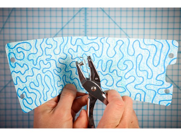 Use a standard hole punch to punch out the circles where shown.