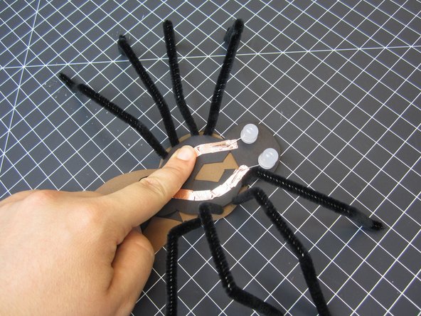 Use tape or glue to connect it to the main body.