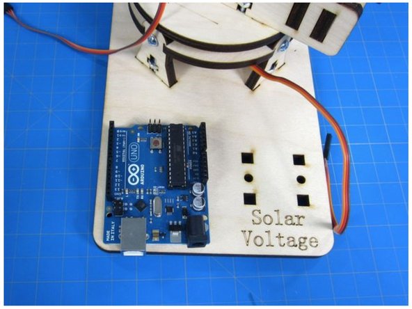 Use two of the M3 screws to screw the Arduino into the base.